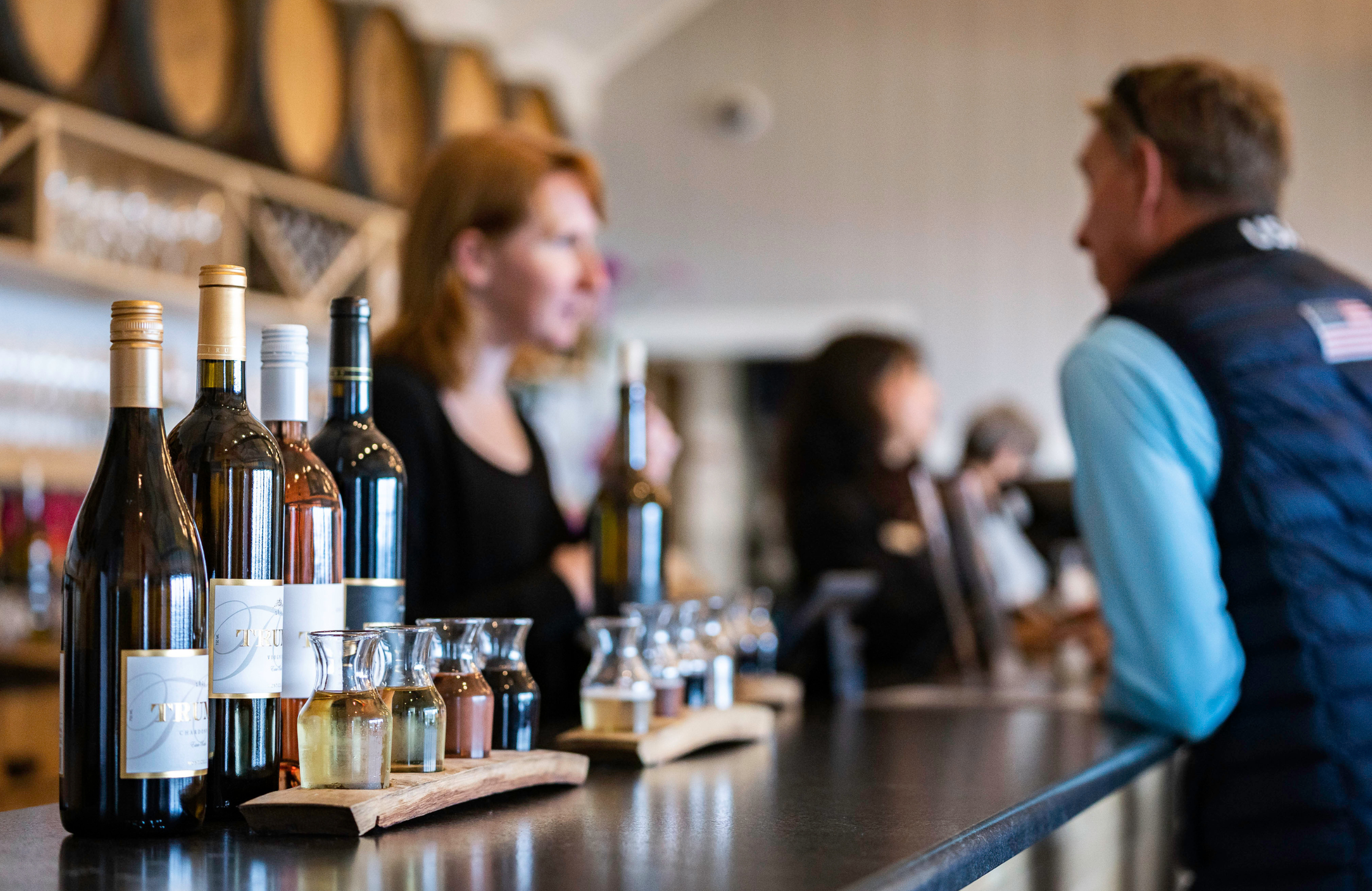 Two wine tasting flights on a bar